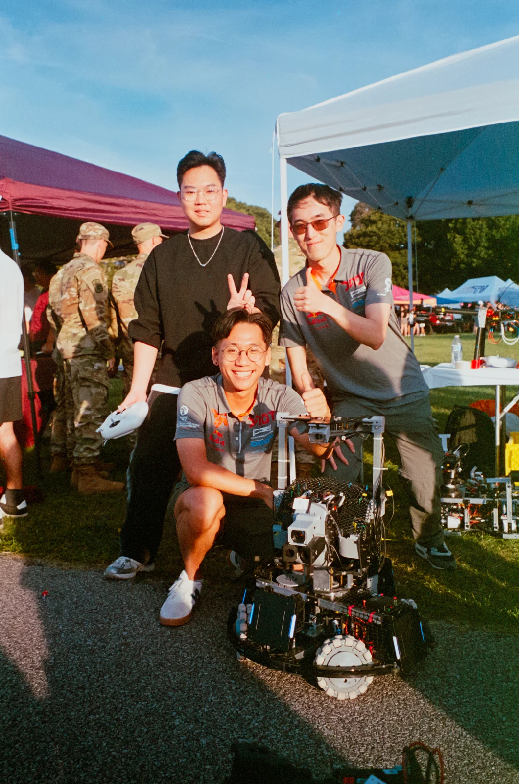 RoboGrinder members smiling with their robot at Gobblerfest